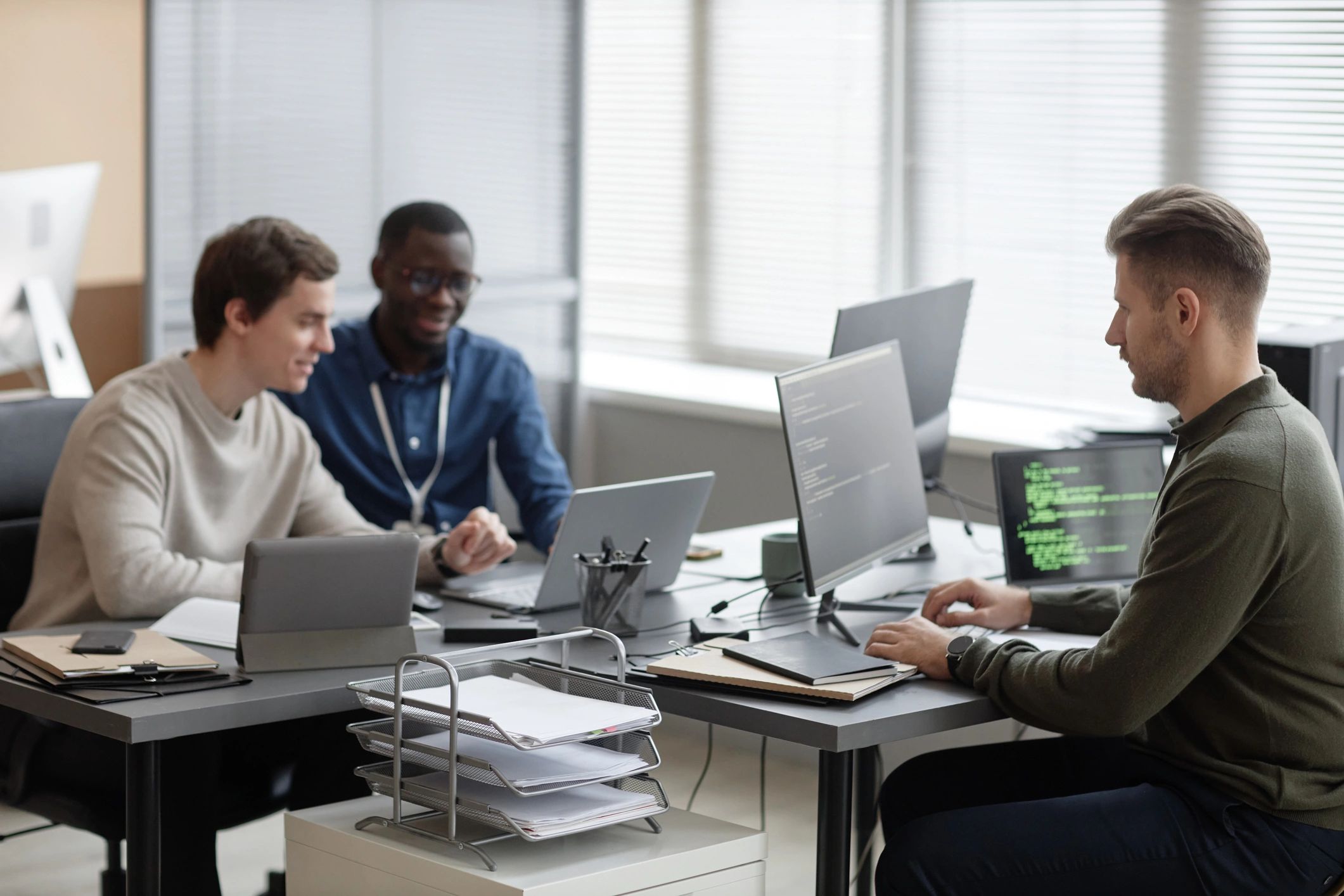 IT professionals collaborating in a modern office