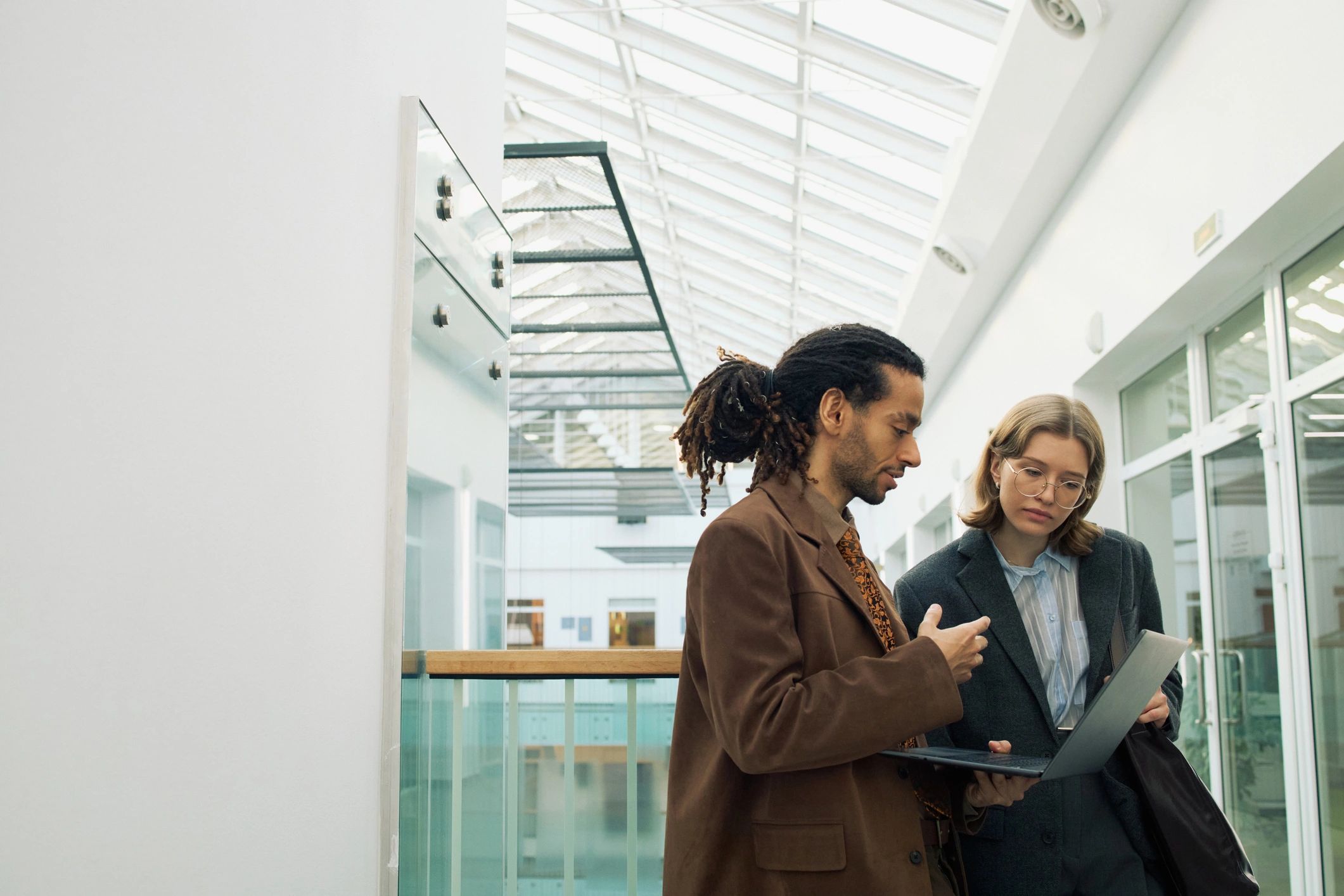Business professionals reviewing IT plans on a laptop