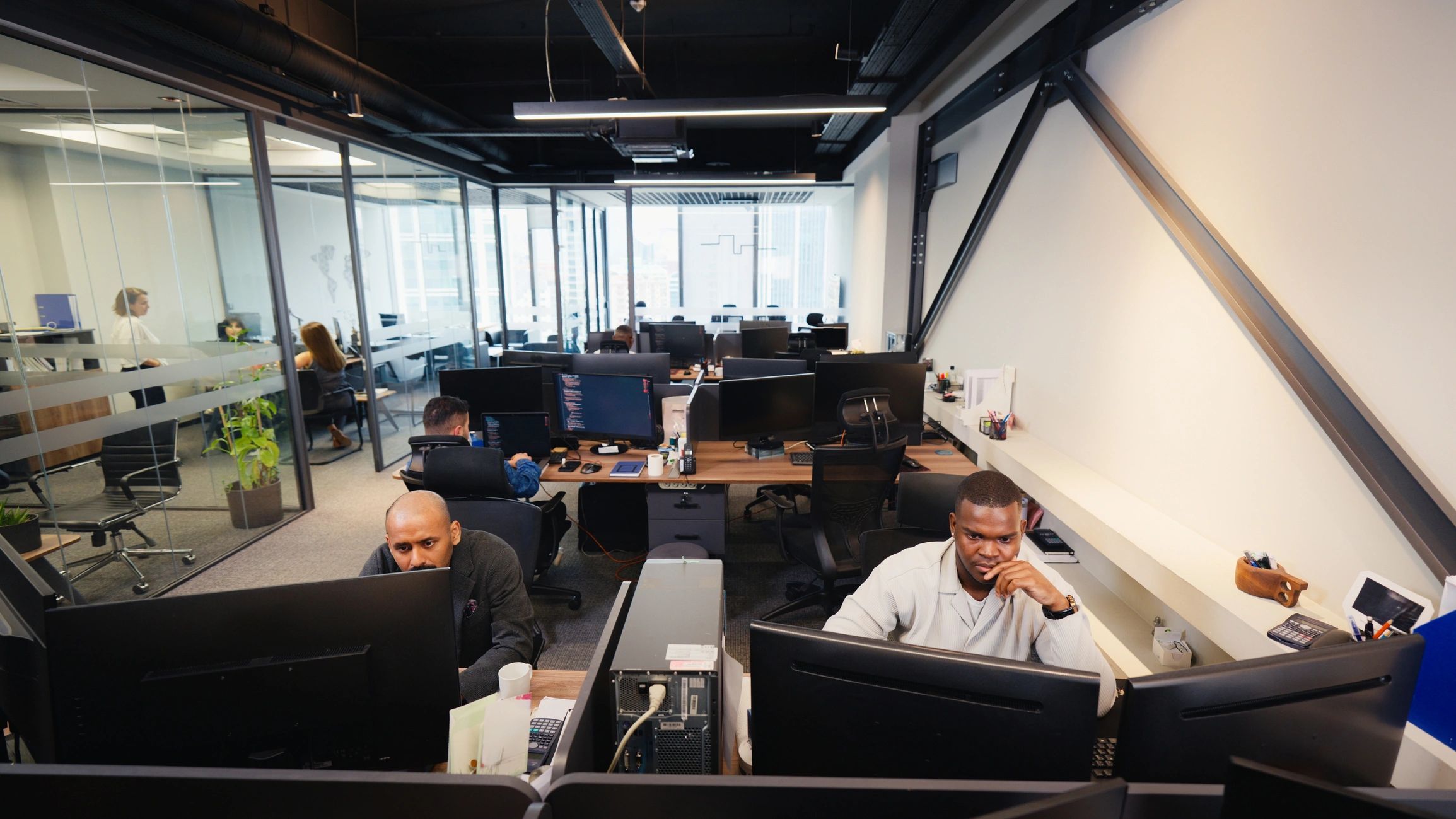 Business team working in a modern office supported by cloud technology